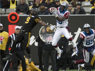 Montreal Alouettes slotback S.J. Green (19) catches a touchdown pass past Hamilton Tiger-Cats defensive back Brandon Stewart (9) during first half CFL Eastern Division final football action in Hamilton, Ont., on Sunday, November 23, 2014.