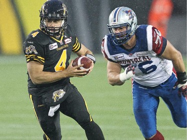 Zach Collaros of the Hamilton Tiger-cats takes off with the ball against the Montreal Alouettes in a CFL football game at Tim Hortons Field on November 8, 2014 in Hamilton.