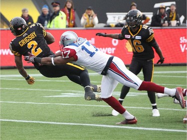 HAMILTON, ON - NOVEMBER 23:  Nic Grigsby #2 of the hamilton Tiger-Cats scores a touchdown against the Montreal Alouettes in the CFL football Eastern Conference Final at Tim Hortons Field on November 23, 2014 in Hamilton, Ontario, Canada.