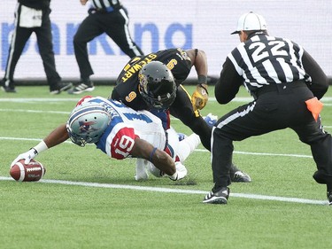 HAMILTON, ON - NOVEMBER 23:  S.J. Green #19 of the Montreal Alouettes scores a touchdown against Brandon Stewart #9 of the Hamilton Tiger-Cats in the CFL football Eastern Conference Final at Tim Hortons Field on November 23, 2014 in Hamilton, Ontario, Canada.