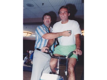 Montreal Canadiens defenceman Guy Lapointe checks the heart rate of stationary bike-riding teammate Guy Lafleur in this 1970s photo.