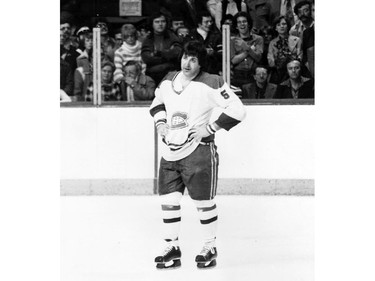 Montreal Canadiens defenceman Guy Lapointe on Montreal Forum ice following a fight during a 1970s game.