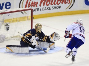 Montreal Canadiens' P.A. Parenteau (15) beats Buffalo Sabres goaltender Michal Neuvirth for the final shootout goal in an NHL hockey game Wednesday, Nov. 5, 2014, in Buffalo, N.Y. The Canadiens won 2-1.