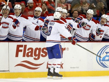 Montreal Canadiens right wing Brandon Prust (8) celebrates his goal against the Detroit Red Wings with teammates in the second period of an NHL hockey game in Detroit Sunday, Nov. 16, 2014.