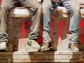 Construction workers take a lunch break.