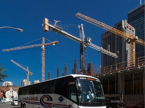 A view of construction cranes against the Montreal skyline, on Monday, August 25, 2014.