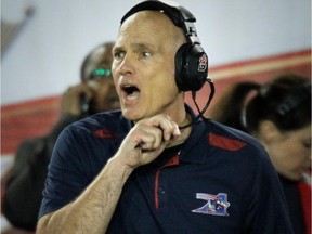 Alouettes head coach Tom Higgins yells at his players during victory over the Ottawa Red Blacks in CFL action at Montreal's Molson Stadium on Aug. 29, 2014.