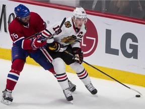 The Canadiens' P.K. Subban checks the Chicago Blackhawks' Jonathan Toews during NHL game at the Bell Centre in January 2014.