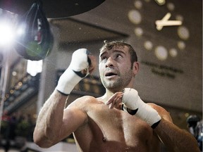 Lucian Bute hits the speed bag during a public training session at Montreal's Complexe Desjardins  on Jan. 13, 2014.