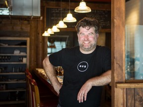 Chef David Ferguson poses of restaurant Gus, wants more people to donate socks to the needy.