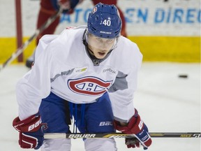 Canadiens defenceman Nathan Beaulieu takes a break during workout at the team's Brossard training facility on July 7, 2014.