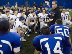 Université de Montréal head football coach Danny Maciocia talks with his team following training camp on March 6, 2011.