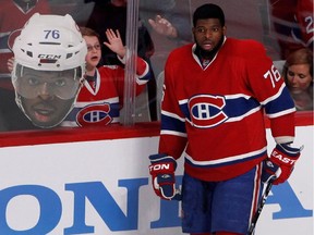 A young fan tries to get the attention of the Canadiens' P.K. Subban as he takes part in pregame skate before Game 5 of the Eastern Conference final against the New York Rangers at the Bell Centre on May 27, 2014.