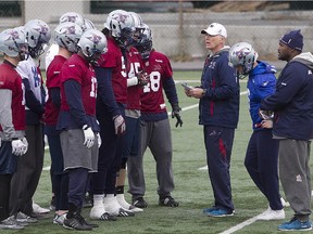 Alouettes head coach Tom Higgins speaks to his players during practice at St. Léonard's Stade Hébert on Nov. 6, 2014.