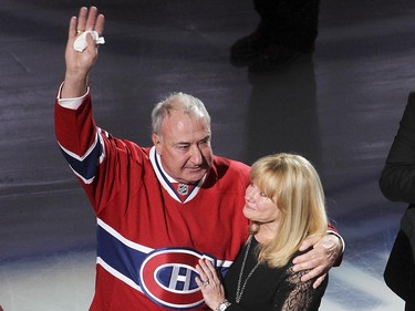 Guy Lapointe, waves to the crowd, next to his wife, Louise, during the retirement of Lapointe's number at the Bell centre  in Montreal on Saturday November 08, 2014.
