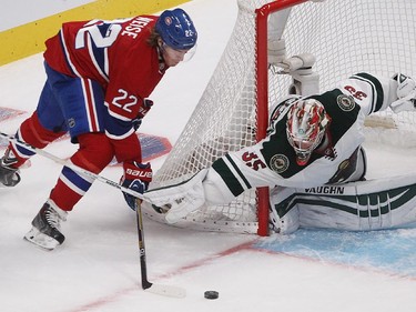 Montreal Canadiens' Dale Weise, left, tries to get puck past Minnesota Wild goalie Darcy Kuemper during third period NHL action in Montreal on Saturday November 08, 2014.