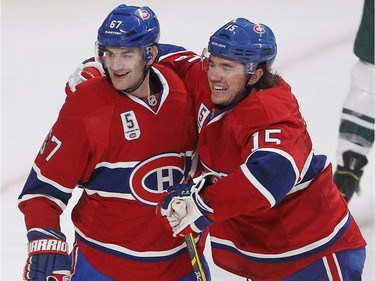Montreal Canadiens' Max Pacioretty, left, celebrates his goal with Montreal Canadiens' P.A. Parenteau during third period NHL action in Montreal on Saturday November 08, 2014.