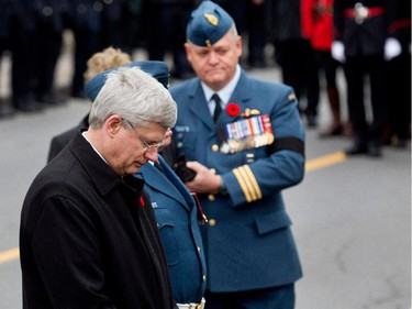 Canadian Prime Minister Stephen Harper pays his respects as the hearse prepares to leave the St-Antoine-de-Padoue Co-Cathedral after funeral services for Master Warrant officer Patrice Vincent in Montreal on Saturday November 1, 2014. Vincent died Oct. 20 when Martin Couture-Rouleau ran Vincent down with his car in St-Jean-sur-Richelieu.