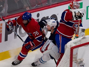 Canadiens goalie Carey Price, right, scrambles to get out of the way as defenseman P.K. Subban and Jets left wing T.J. Galiardi round the net during action at the Bell Centre on Tuesday, Nov. 11, 2014.