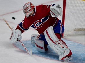 Carey Price deflects a shot by Mark Scheifele at the Bell Centre on Tuesday, Nov. 11, 2014.