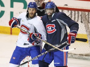 Canadiens' Brandon Prust and P.K. Subban battle for position in front of the net during practice on Nov. 12, 2014 at the Bell Sports Complex in Brossard.