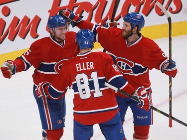 Jiri Sekac of the Montreal Canadiens celebrates his goal in the third period against the Boston Bruins with teammates Lars Eller and Brandon Prust in an NHL game Thursday, November 13, 2014 at the Bell Centre in Montreal.