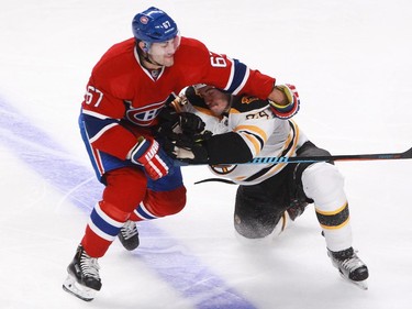 Max Pacioretty of the Montreal Canadiens tries to get by Adam McQuaid of  the Boston Bruins in second period of an NHL game Thursday, November 13, 2014 at the Bell Centre in Montreal.