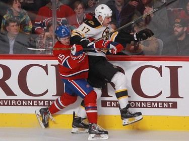 P.A. Parenteau of the Montreal Canadiens gets an elbow in the jaw from Milan Lucic of the Boston Bruins in first period of an NHL game Thursday, November 13, 2014 at the Bell Centre in Montreal.