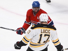P.K. Subban of the Montreal Canadiens yells at Milan Lucic of the Boston Bruins in the second period of an NHL game Thursday, November 13, 2014, at the Bell Centre in Montreal. Subban had cross-checked Lucic and was given a penalty.