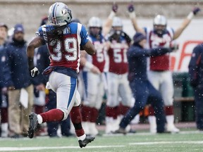 Alouettes defensive- back Jerald Brown runs toward the end zone for a touchdown during CFL East Division semifinal against the B.C. Lions at Molson Stadium. The Alouettes won the game  50-17.