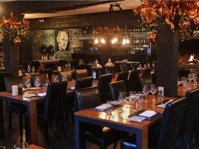 The dining room at the Auberge le St-Gabriel has two fireplaces.