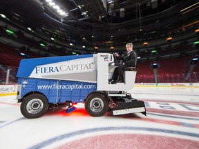 Keith Tombs drives a Zamboni to resurface the ice at the Bell Centre on Nov. 18, 2014.