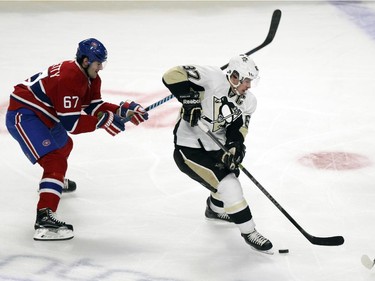 Montreal Canadiens Max Pacioretty, left, and Sergei Gonchar pressure Pittsburgh Penguins Sidney Crosby during National Hockey League game in Montreal Tuesday November 18, 2014.