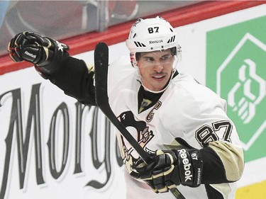 Pittsburgh Penguins' Sidney Crosby celebrates his second-period power-play goal  against the Canadiens in Montreal Tuesday, Nov, 18, 2014.