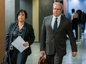 Psychiatrist Gilles Chamberland, right, during a break for the trial of Luka Magnotta at the Montreal courthouse in Montreal on Tuesday, November 18, 2014.