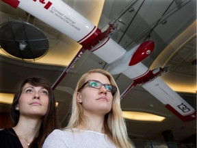 Tiphaine Fillon, left, and Sabrina Watelle at the entrance of Montreal's École Polytechnique. The two young women are a minority in their engineering classes.