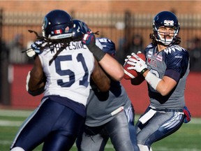 Alouettes quarterback Jonathan Crompton looks for an opening against the Toronto Argonauts during CFL action at Molson Stadium on Nov. 2, 2014.