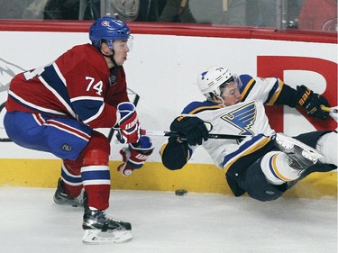Montreal Canadiens Alexei Emelin, left, checks St. Louis Blues T.J. Oshie during National Hockey League game in Montreal Thursday November 20, 2014.