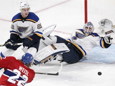 Montreal Canadiens Dale Weise shoots the puck past St. Louis Blues goalie Jake Allen and defenceman Kevin Shattenkirk for an unassisted goal during second period of National Hockey League game in Montreal Thursday November 20, 2014.