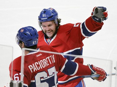 Montreal Canadiens David Desharnais celebrates with Max Pacioretty after Pacioretty scored his second goal of the game in the third period against the St. Louis Blues during National Hockey League game in Montreal Thursday November 20, 2014.