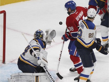 Montreal Canadiens Drayson Bowman looks at rebound between St. Louis Blues goalie Jake Allen and defenceman Kevin Shattenkirk during National Hockey League game in Montreal Thursday November 20, 2014.