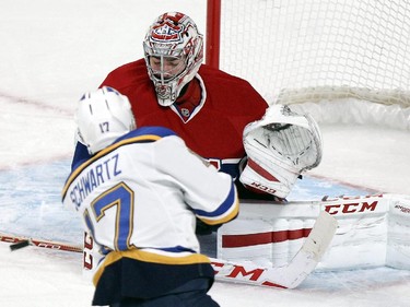 Montreal Canadiens goalie Carey Price makes a save against St. Louis Blues Jaden Schwartz during third period of National Hockey League game in Montreal Thursday November 20, 2014.