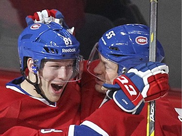 Montreal Canadiens Lars Eller, left, celebrates his third-period goal against the St. Louis Blues with teammate Sergei Gonchar during National Hockey League game in Montreal Thursday November 20, 2014.