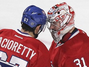 Montreal Canadiens Max Pacioretty congratulates goalie Carey Price following the Habs 4-1 victory over the St. Louis Blues during National Hockey League game in Montreal Thursday November 20, 2014.  Pacioretty scored two goals and was named first star. Price was named second star.