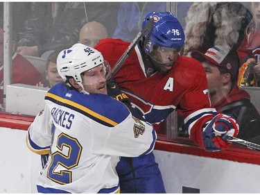 Montreal Canadiens P.K. Subban is ridden into the boards by St. Louis Blues David Backes during National Hockey League game in Montreal Thursday November 20, 2014.