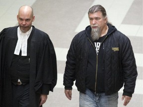 Salvatore Cazzetta, right, leaves a Longueuil courthouse south of Montreal, with his lawyer, Thursday Nov. 20, 2014.