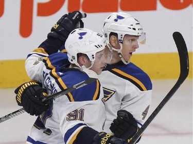 St. Louis Blues Vladimir Tarasenko, 91, celebrates his first-period goal with teammate Carl Gunnarsson during National Hockey League game against the Canadiens in Montreal Thursday November 20, 2014.