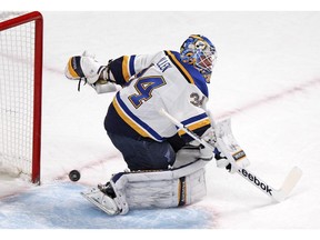 MONTREAL, QUE.: November 20, 2014 -- The pluck passes through the crease behind St. Louis Blues goalie Jake Allen during National Hockey League game against the Canadiens in Montreal Thursday November 20, 2014. ({John Mahoney / MONTREAL GAZETTE)