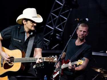 Country superstar Brad Paisley, left,  performs at the Bell Centre in Montreal on Saturday November 22, 2014.