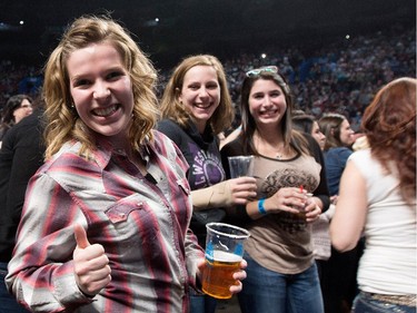 Fans wait for Country superstar Brad Paisley, not seen, at the Bell Centre in Montreal on Saturday November 22, 2014.